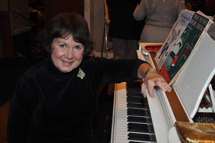 Ann Weber plays piano at the event
