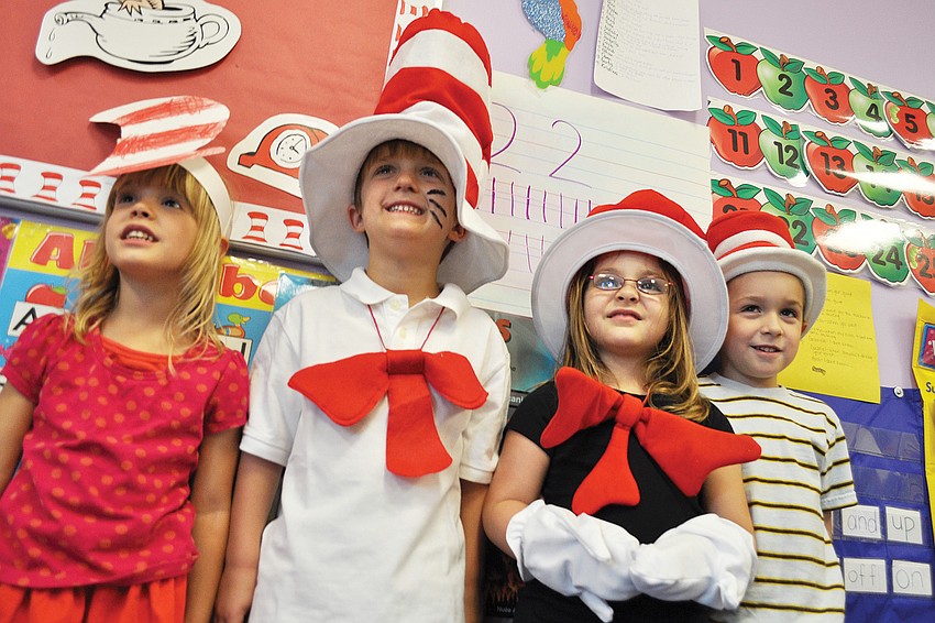 Paeten Feathers, Matt Schefer, Cayla Weinsberg and Curtis Reynolds dressed as the Cat in the Hat for Kiddie Academy of Lakewood Ranch's Dr. Seuss party March 2. Published March 10, 2011.