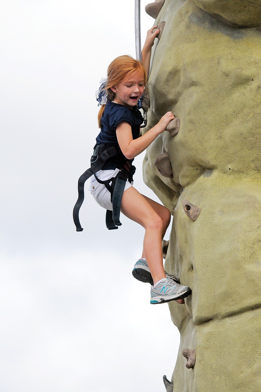 Six-year-old Kendall Dooley was determined to make it all the way to the top of the rock wall at The Out-of-Door Academyâ€™s annual Thunder Fun Day Nov. 19.