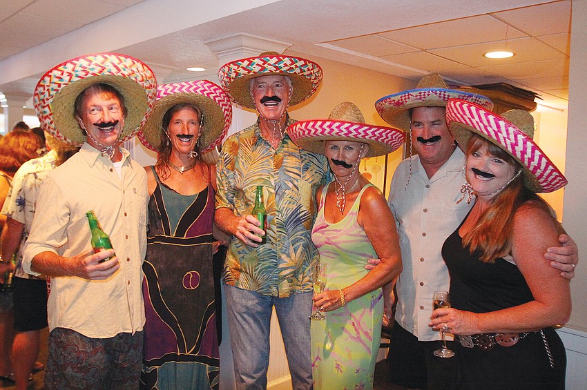 Mike and Cyndi Seamon, Bill and Meiki Dooley and Chris and Patti Sileo dressed the part for the July Mexican-themed interactive dinner at Pattiegeorge's.