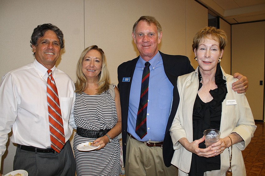 Paul and Donna Rutledge and Harold and Marsha Nippert enjoy each otherâ€™s company at Church of the Redeemerâ€™s kick-off celebration for the Oct. 9 400th anniversary of the King Jamesâ€™ Bible.