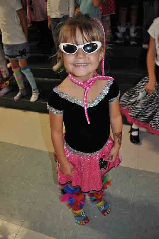 Issy Monroe won the silly sock contest for kindergarteners. She and her mother glued feathers on her socks to make them extra special.