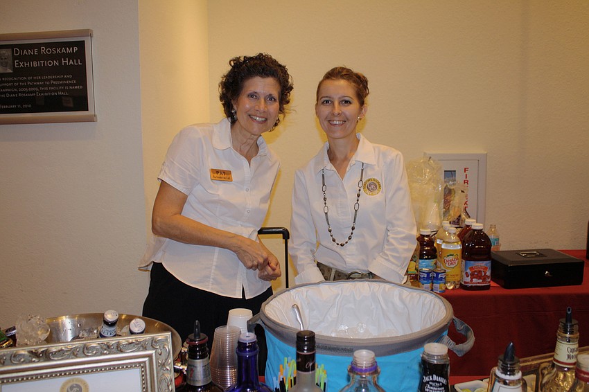 Bartender-on-Call Pat Krohmer poses with owner of Gordonâ€™s Gourmet Esther Williams.