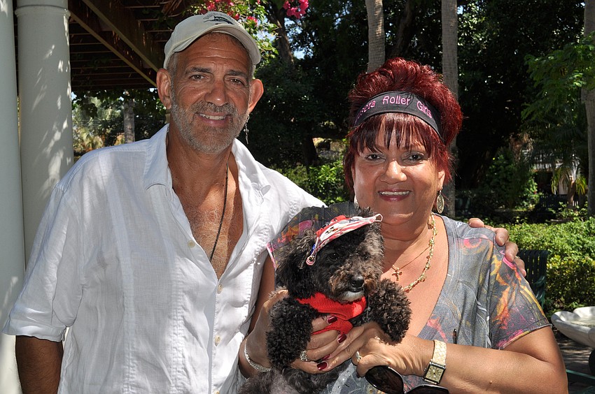 Steve and Yvette Sanford with their dog Lola. Yvette was in a wheelchair for 12 years, and is now walking because of Lola, whom she got four to five months ago. 