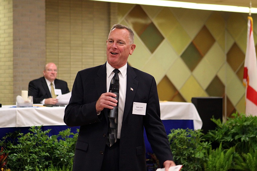 Terry Lewis, interim Country administrator, speaks to the crowd, Monday, Nov. 14, at the Potter Building.
