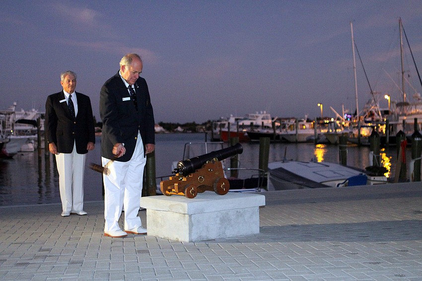 Bobby Overall set off the cannon during the Sundowner Ceremony, Friday, Dec. 2, at the Sarasota Yacht Club.