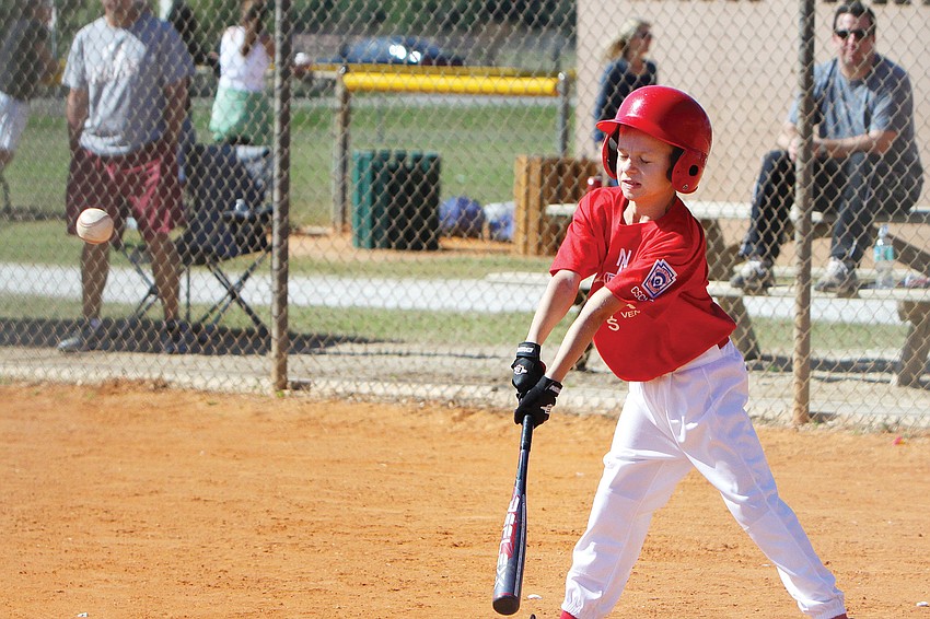 Everest Moll hit the ball at the opening day of Central Sarasota County Little League.