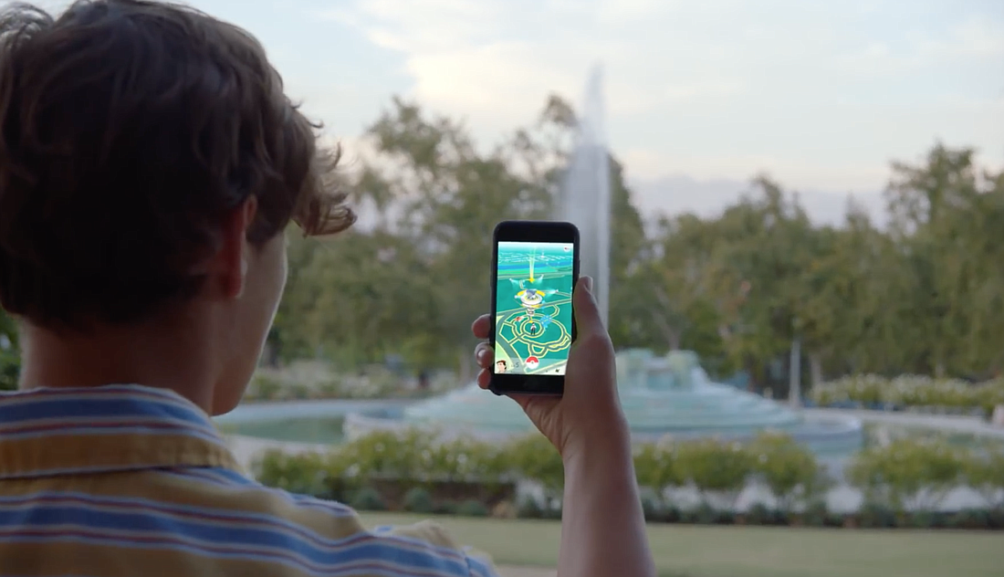 This image is a still from a promotional video for "Pokemon Go" on pokemon.com.