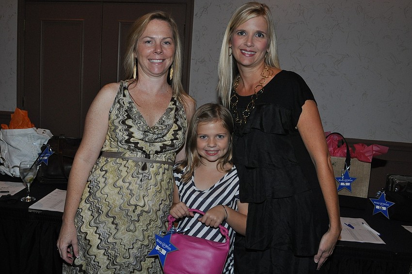 Paula and Hannah Swain and Executive Director Michelle Butler