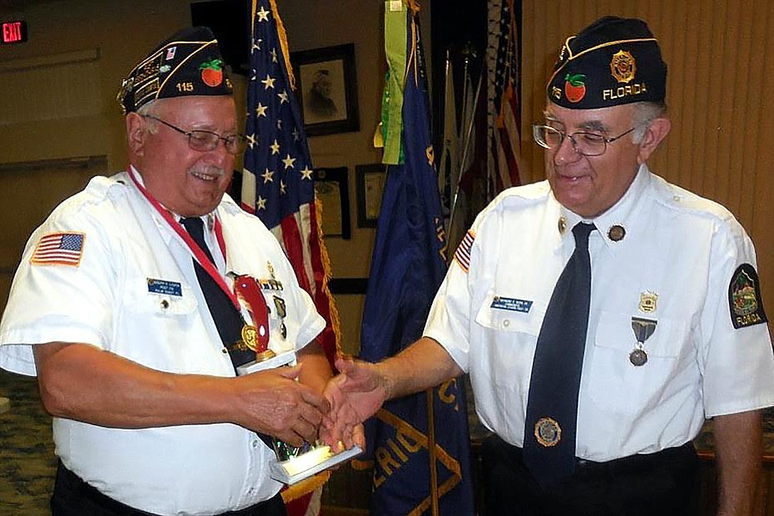 Joseph Licata, Flagler American Legion Post 115, receives the coveted Red Pepper Trophy from Commander Raymond Work, for his winning secret chili recipe. Courtesy photo