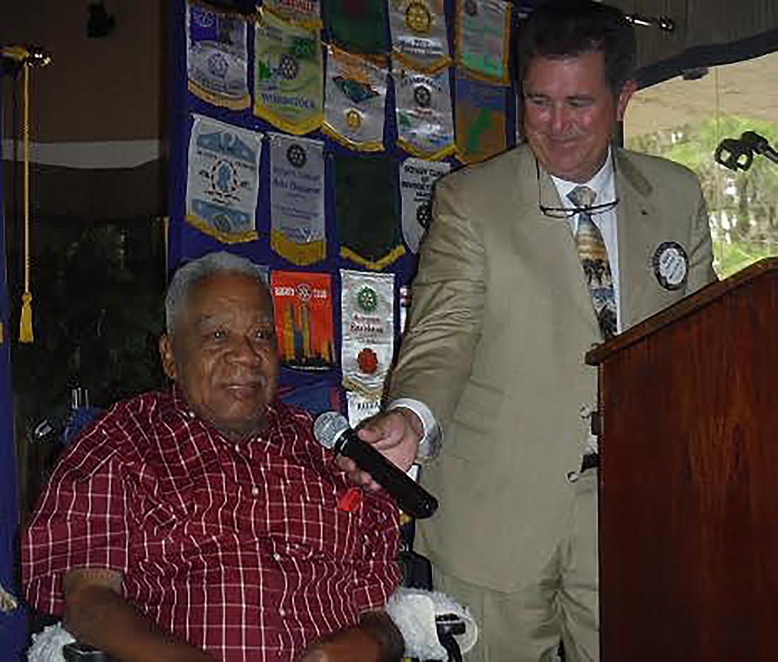 Flagler County Rotary past President Kent Ryan makes the presentation to Dr. Jim Guines. Courtesy photo