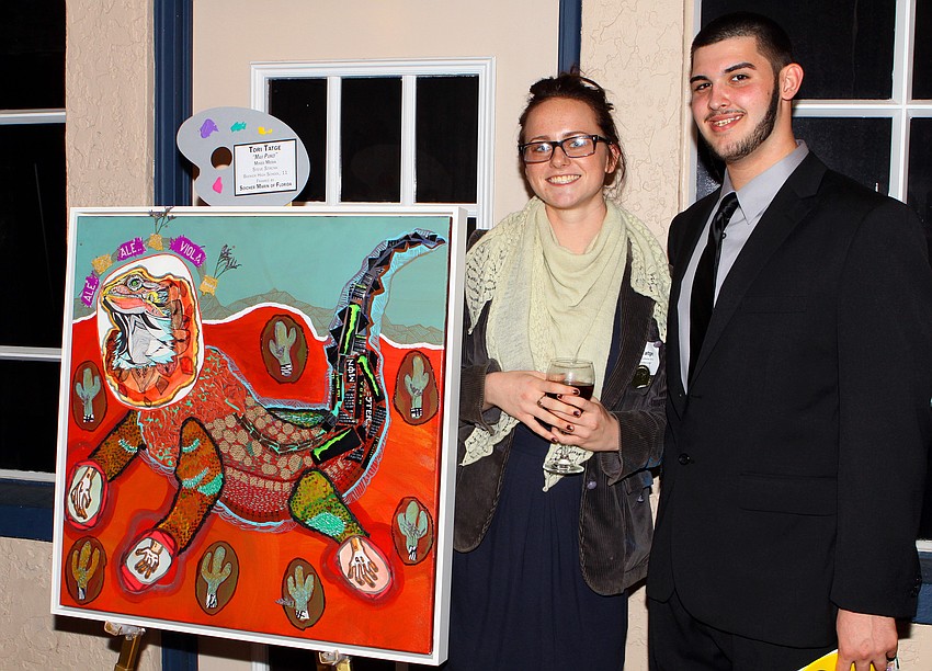 Tori Tatge and Michael Mitchell with Tatge's piece 