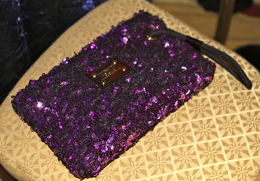 Susan Jones wore a purple Louis Vuitton bag to the gala.