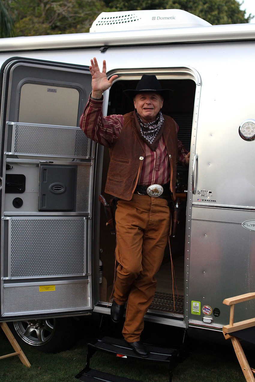 Dr. Larry Thompson waves to the crowd.