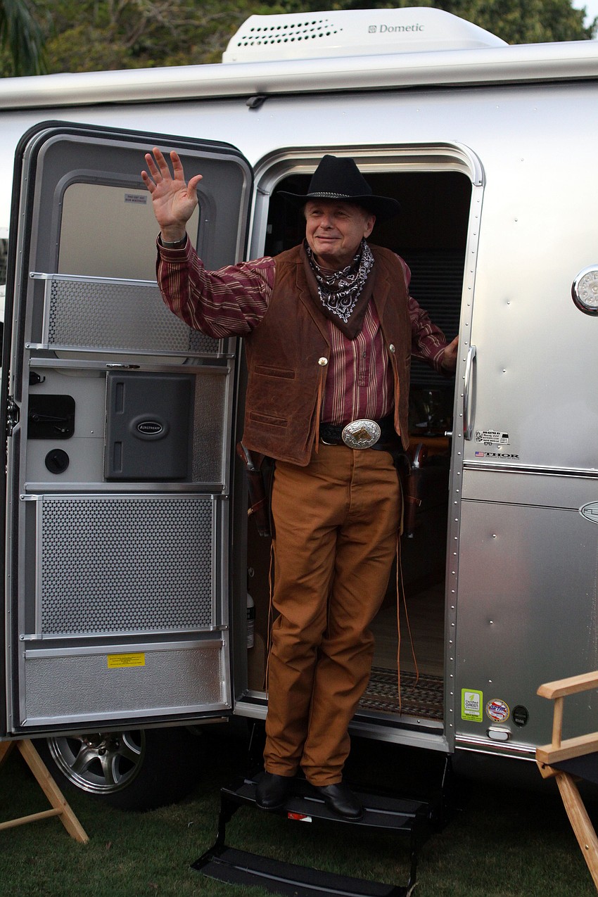 Dr. Larry Thompson waves to the crowd.