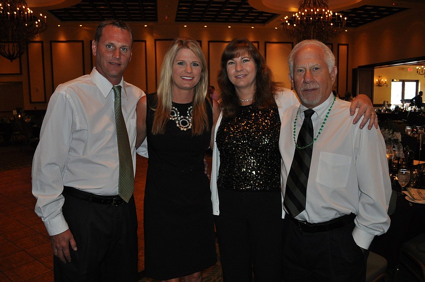 Jim and Ashley Carson with Ashleyâ€™s parents, Susan and Len Tabicman, president of Hope Family Services.