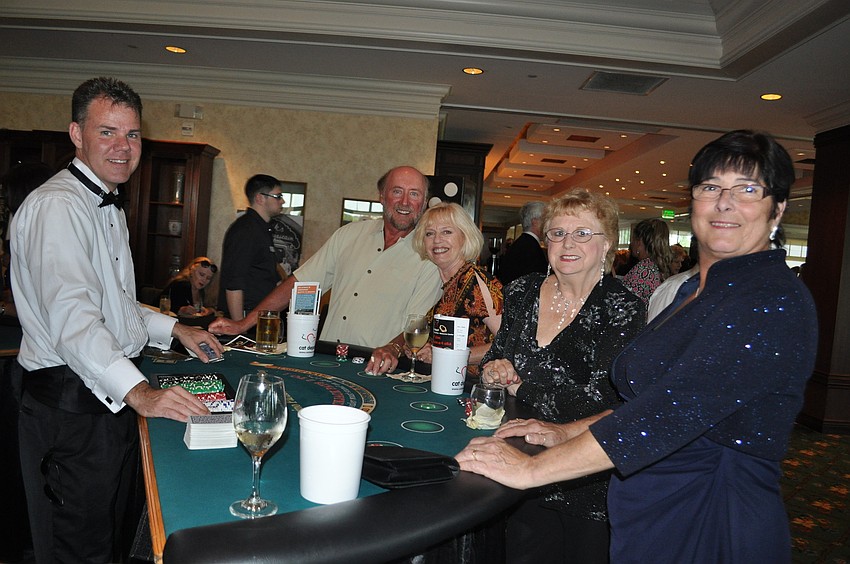 Chase Perkins dealing to Chris Getty, Wendy Johnston, Gloria Grenier and Lynn Ahrends