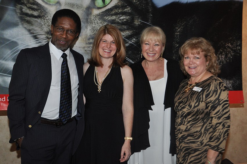 Former Dolphins player Mercury Morris with Cat Depot Director of Operations Karen Slomba, chair of Catâ€™sino event Shelley Thayer and Director of Communications Lynn Rasys