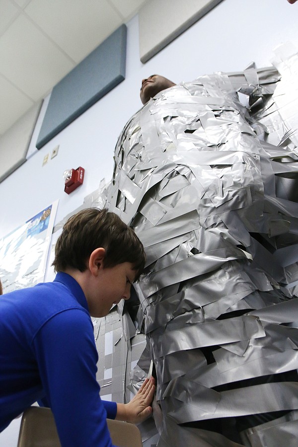 Turrill students tape principal, teachers to wall in fundraiser for new  books - Lapeer Area View