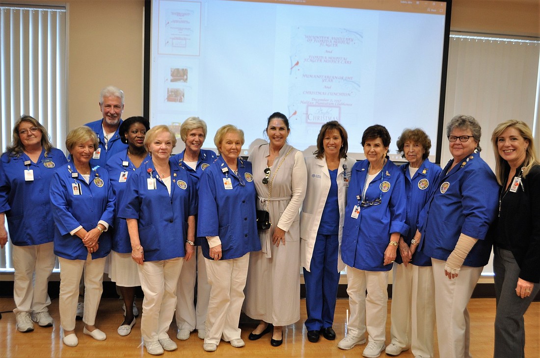 Palm Coast Mayor Milissa Holland (center) installed the Florida Hospital Flagler's volunteer auxiliary's 2018 board members. Photo courtesy of Lindsay Cashio