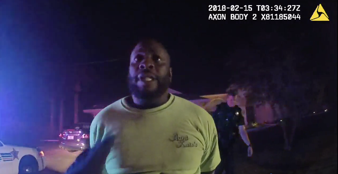 With suspect Leslie Pitter finally in handcuffs, Deputy George Bender tells Pitter why he's being arrested. (Image from FCSO body camera footage.)