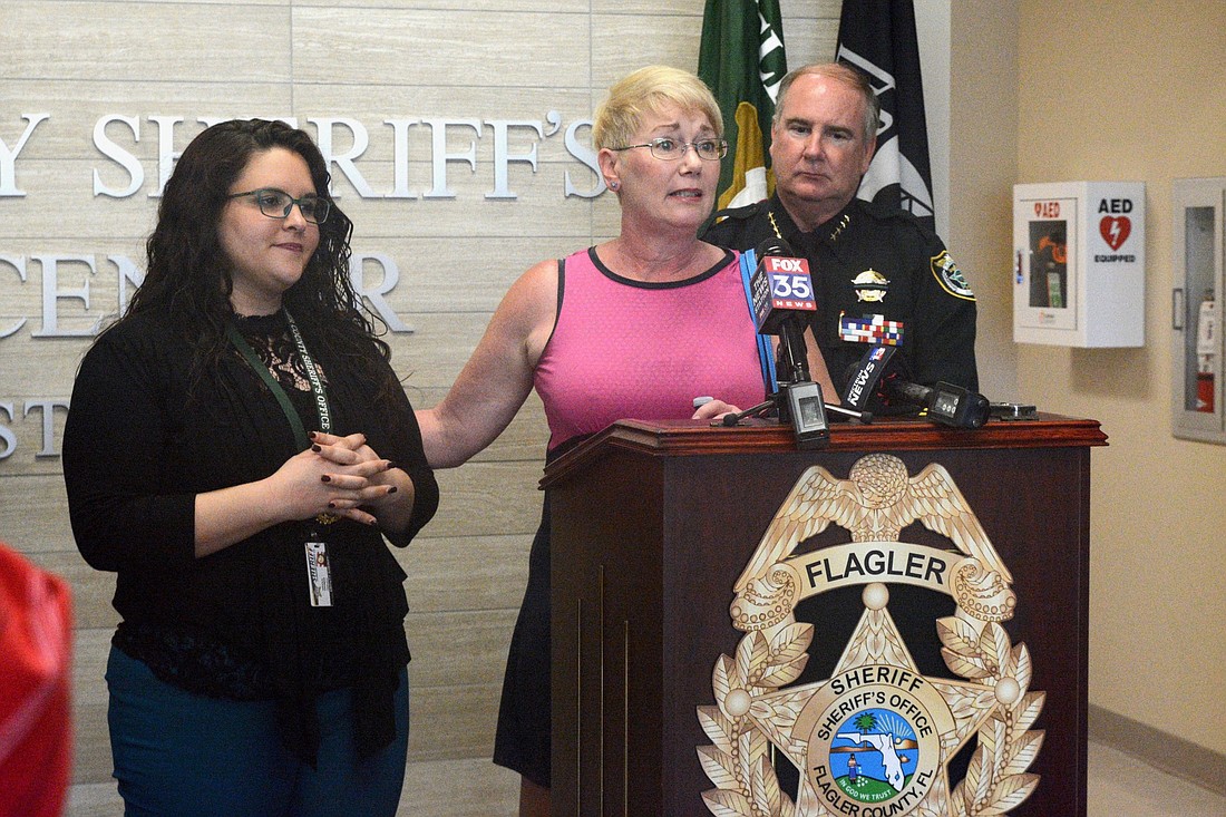 ReneÃ© DeAngelis, mother of victim Savannah DeAngelis, addresses the press Feb. 21. Det. Nicole Thomas is on the left; Sheriff Rick staly is at right. (Photo by Jonathan Simmons)