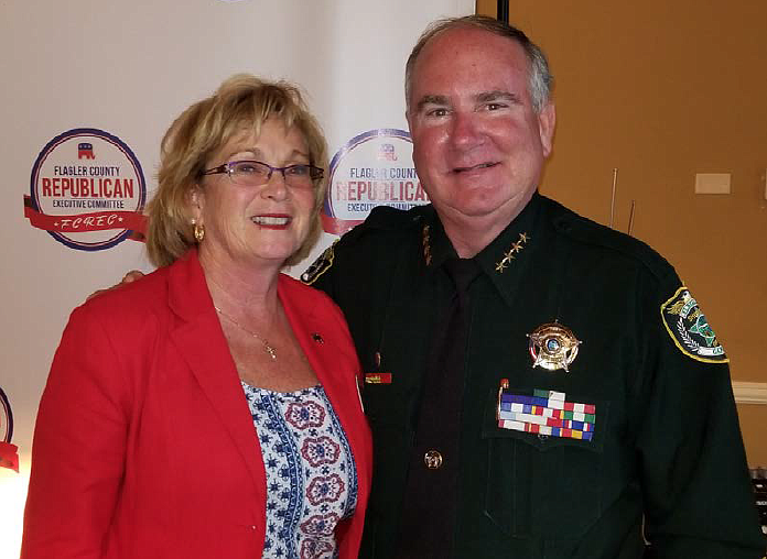 Sharon Demers and Flagler County Sheriff Rick Staly pose together after Staly used the Heimlich maneuver to dislodge food stuck in her airway. Photo courtesy of Brittany Kershaw
