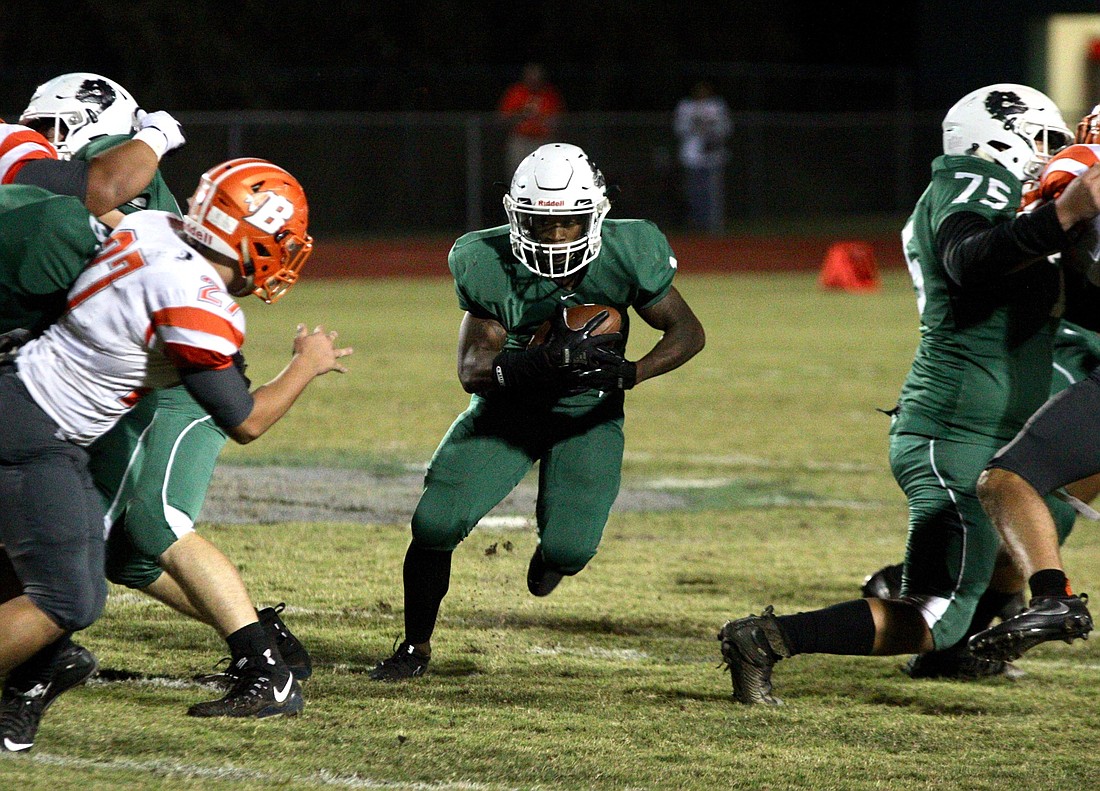 FPC running back Ty Jenkins carries the ball against Orlando Boone. File photo