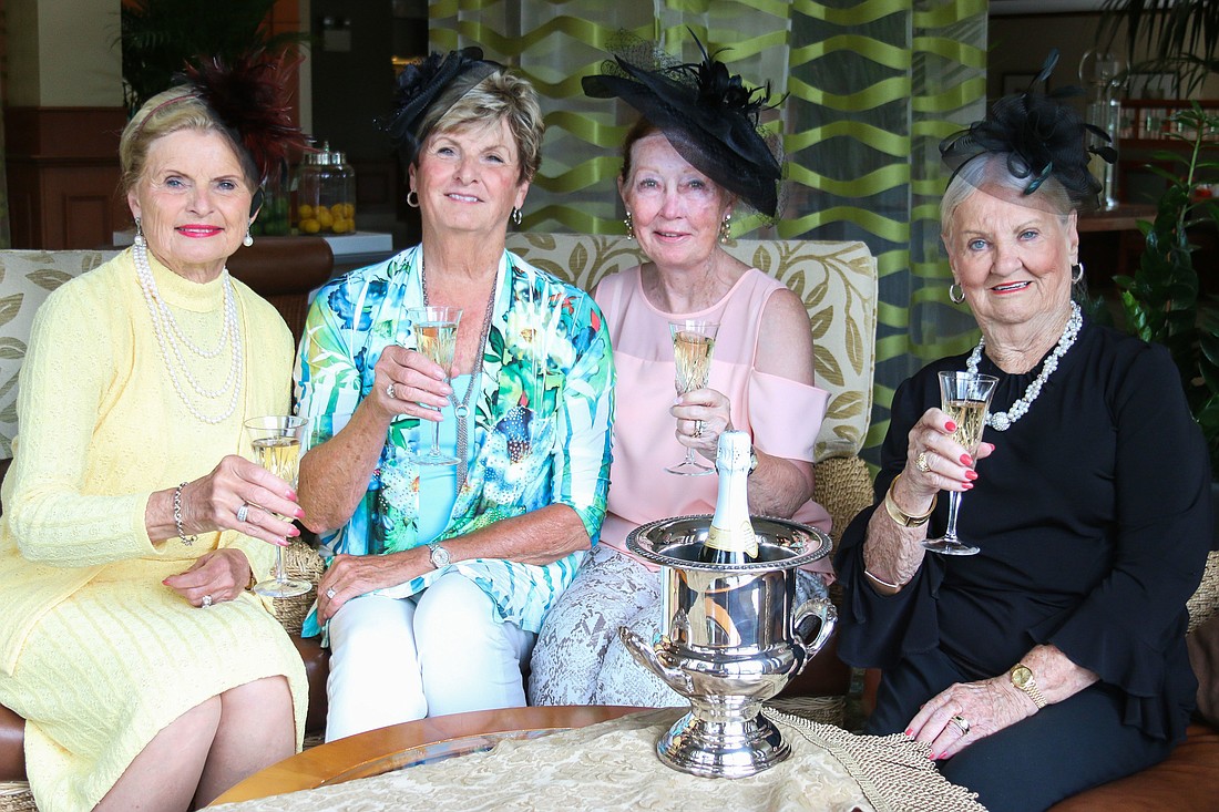 Marilyn Gingles, Sue Freytag, Sandy Haines and Nan Reid pose on Friday before they check into their rooms in the Hilton Garden Inn Palm Coast to watch the British royal wedding on May 19. Photo by Paige Wilson