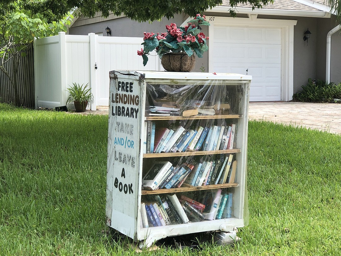 More than 50 books and magazines sit on the free library at 107 Boulder Rock Drive. Photo by Paige Wilson