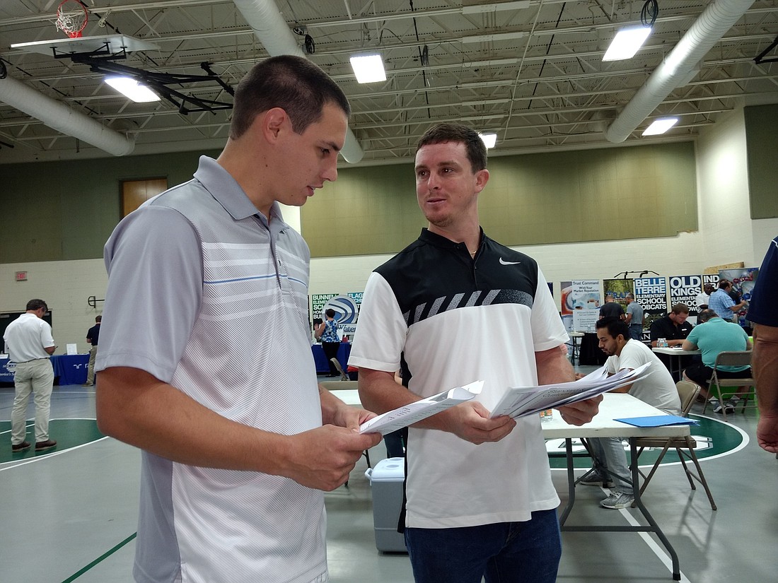Nicholas Michael and Josh Crafton, who worked at Sea Ray for about five years each, attended the job fair at FPC. Photo by Brian McMillan