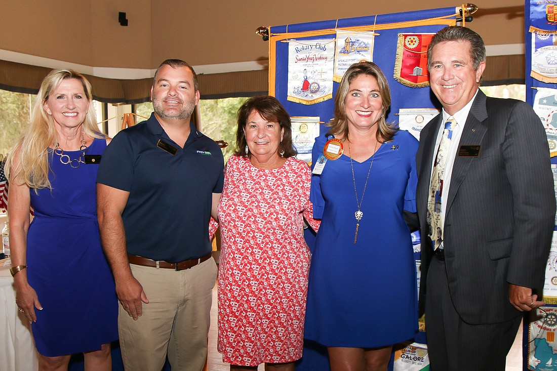 Club President Cindy Evans, sponsor Ryan Smith, Maureen Ryan, Casey Ryan and Kent Ryan pose after inducting Casey into the Rotary Club of Flagler County. Photo by Paige Wilson