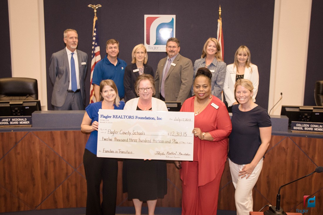 Local Foundation Executive Officer Dorothy Desvousges Sperber and YPN Chair Heather Dalrymple presented a $12,313.15 check to Pamela Jackson Smith, District FIT liaison. Courtesy photo