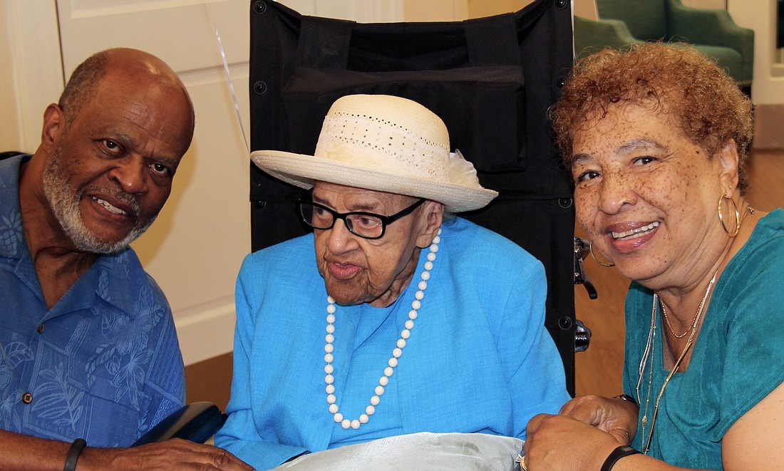 Leon and Pat McLaurin pose with their mother and mother-in-law, Naomi T. McLaurin, during her 102nd birthday celebration on Aug. 6. Courtesy photo