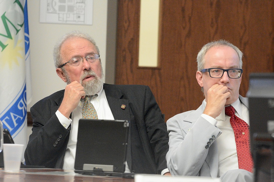 Councilman Bob Cuff, left, speaks during a City Council meeting Sept. 11. Councilman Vincent Lyon is at right. (Photo by Jonathan Simmons)