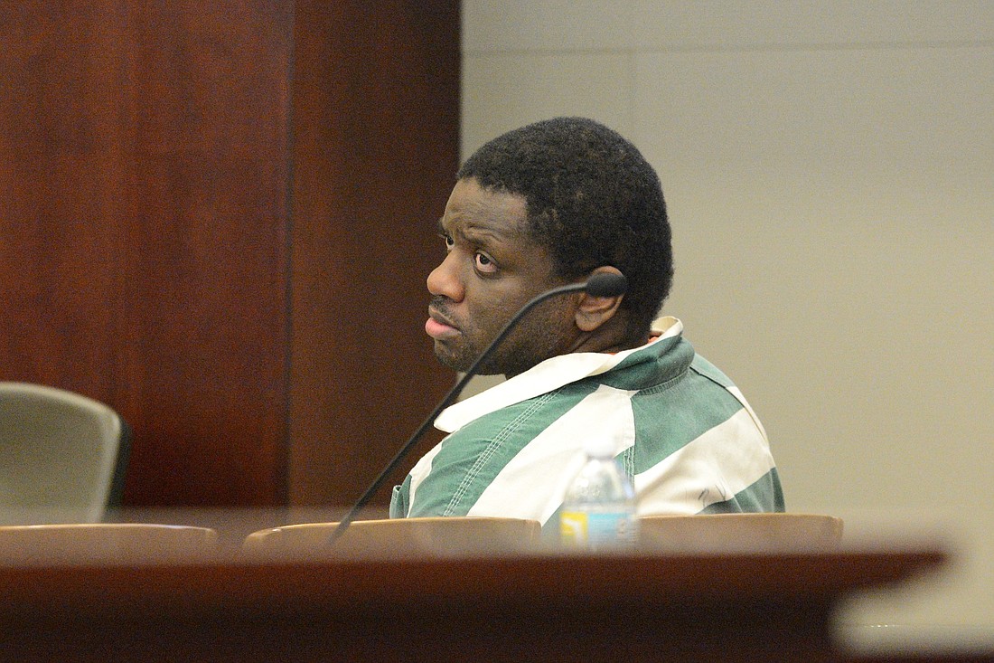 Obtravies Watkins watches his attorney during a pretrial hearing. (Photo by Jonathan Simmons)