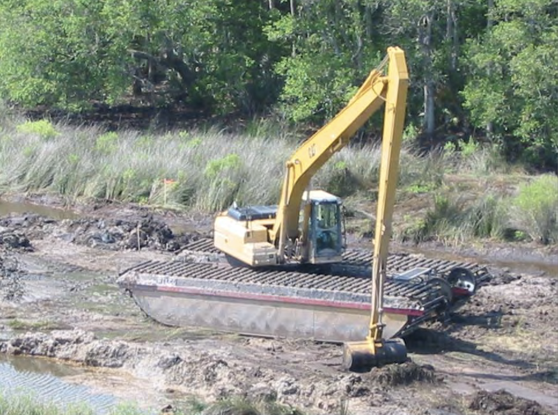 Residents became concerned when they saw earth moving machines like this one show up in local wetlands. (Photo from  county workshop backup documentation)