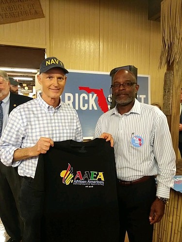 Gov. Rick Scott and AAEA Founder Leslie Giscombe met at a campaign stop at the St. Augustine Whetstone Chocolates.