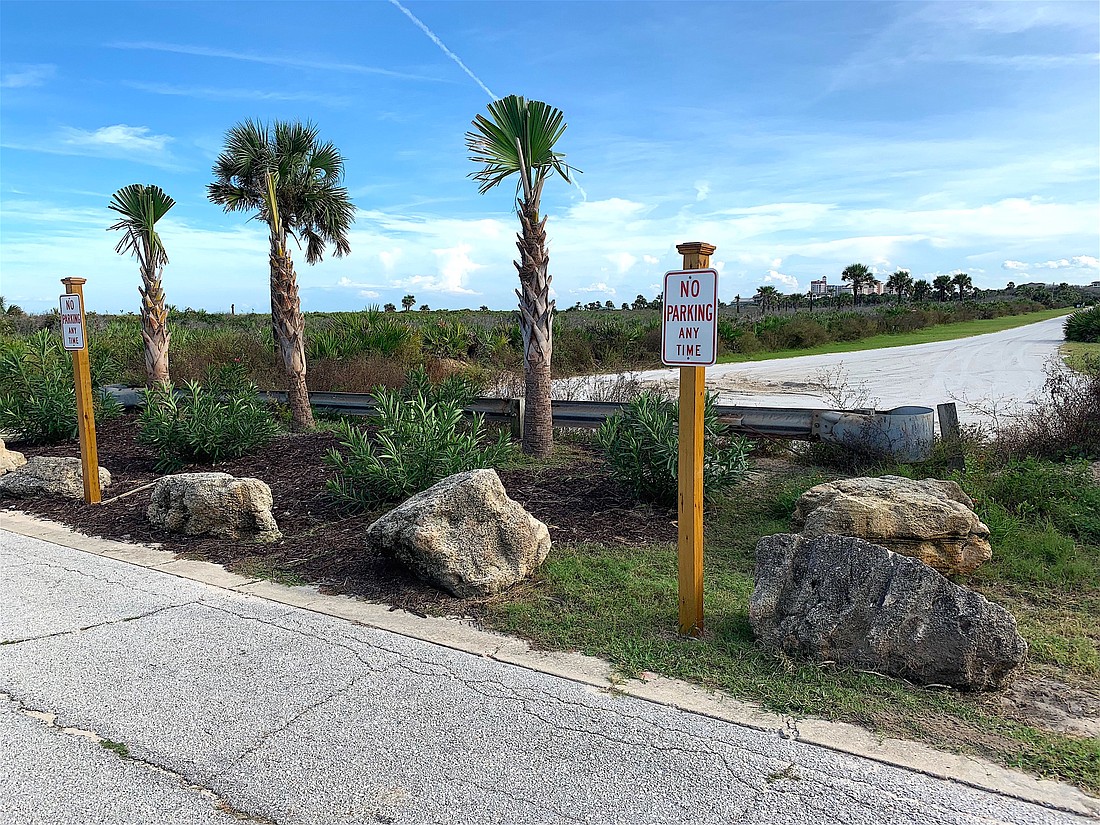 Coquina rocks and landscaping have been added to keep people from parking on the side o Solee Road. Now the HOA and Flagler County are working on a compromise that won't limit' access to the beach. Photo by Sarah Reckenwald