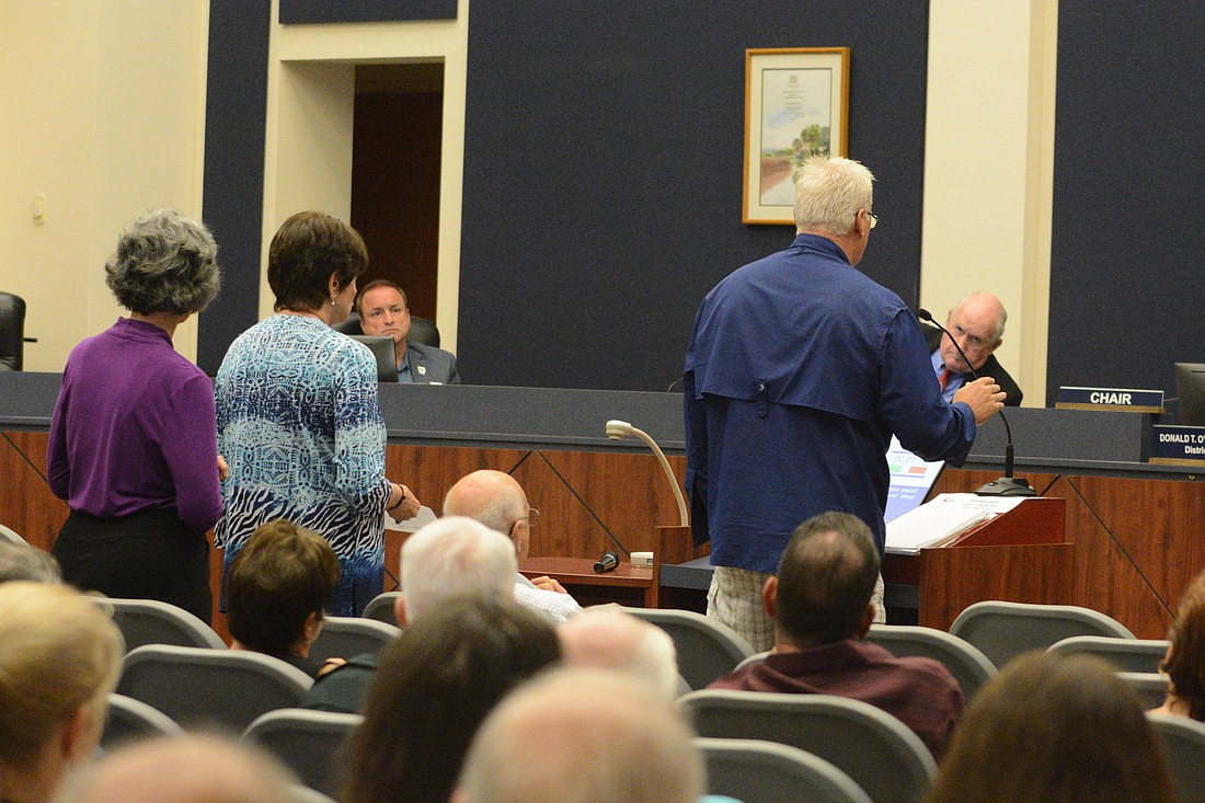 Residents who objected to the county's handling of a proposed expansion of Captain's BBQ at Bings Landing lined up to address the commission Dec. 3.