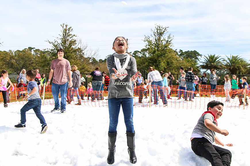Nereyda Campos throws a snowball up in the air during the 2017 Snowfest in Palm Coast. File photo