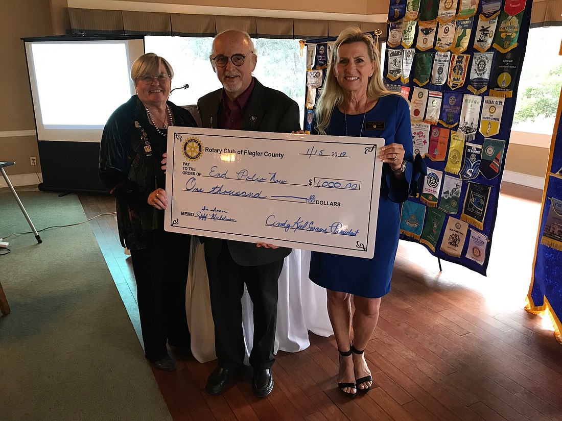 Rotary Club of Flagler County President-Elect Maralee Walsh-McDaniel, Dr. Jeffery Michelman and Rotary Club President Cindy Evans. Photo courtesy of Rotary Club of Flagler County