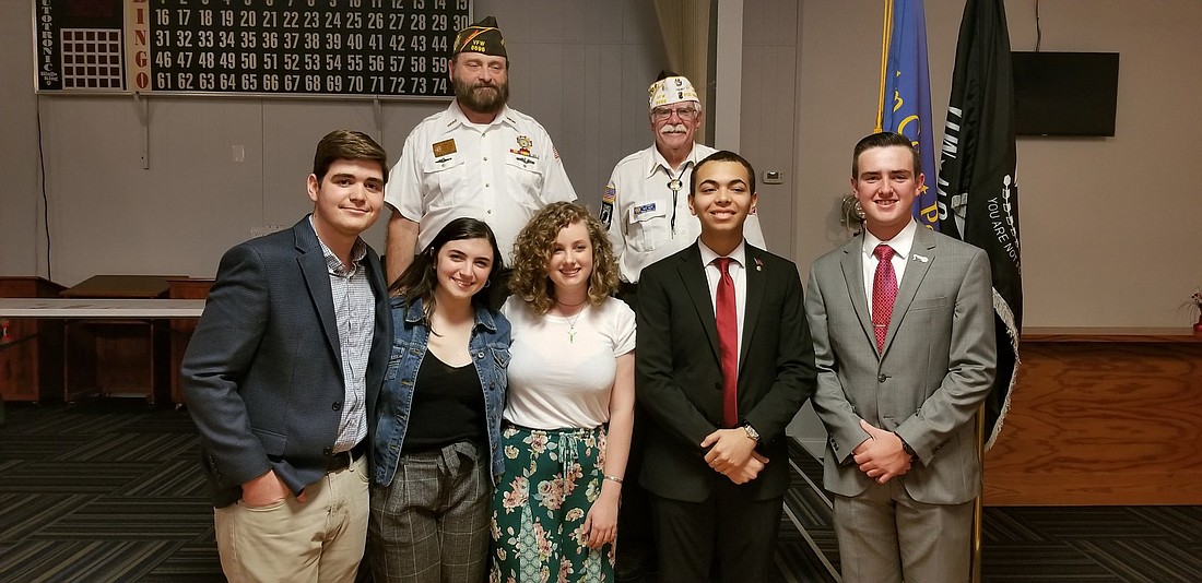 Tyler Perry (first place), Isabella Scarcella (third place), Abigail Miner (fourth place), Nicholas Anane (fifth place) and William Patin (second place) with VFW Cmdr. Keith Tremblay and VFW committee chair Patrick Donnelly.