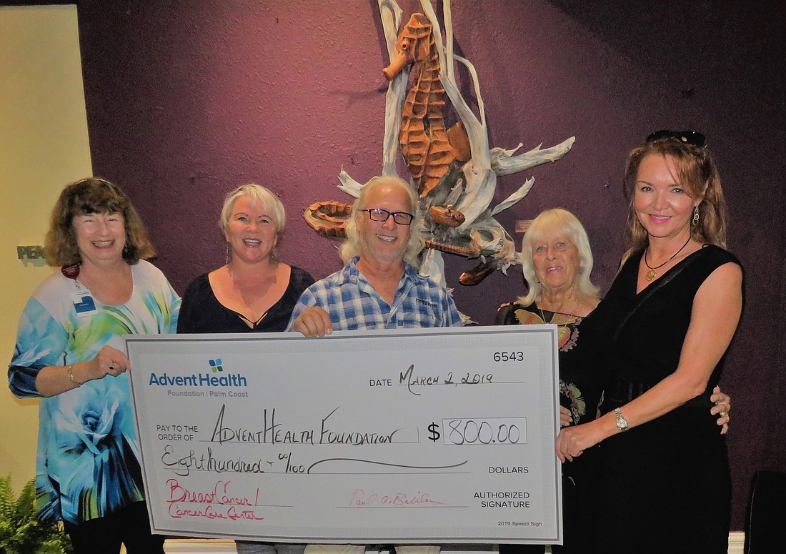 AdventHealth volunteer Debbie Ridgley, AdventHealth Palm Coast Foundation assistant Pam Bolter, artists Paul and Joan Baliker, and Victoria Harper, owner and broker of Berkshire Hathaway HomeServices Fortune Group Properties.