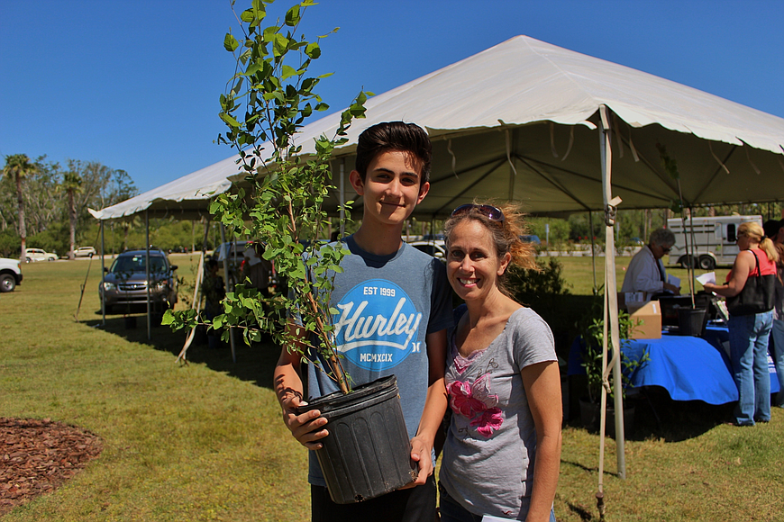 Karin and her son, Grant, picked up a White River Birch for their home, at the Palm Coast Arbor Day celebration in 2017. File photo