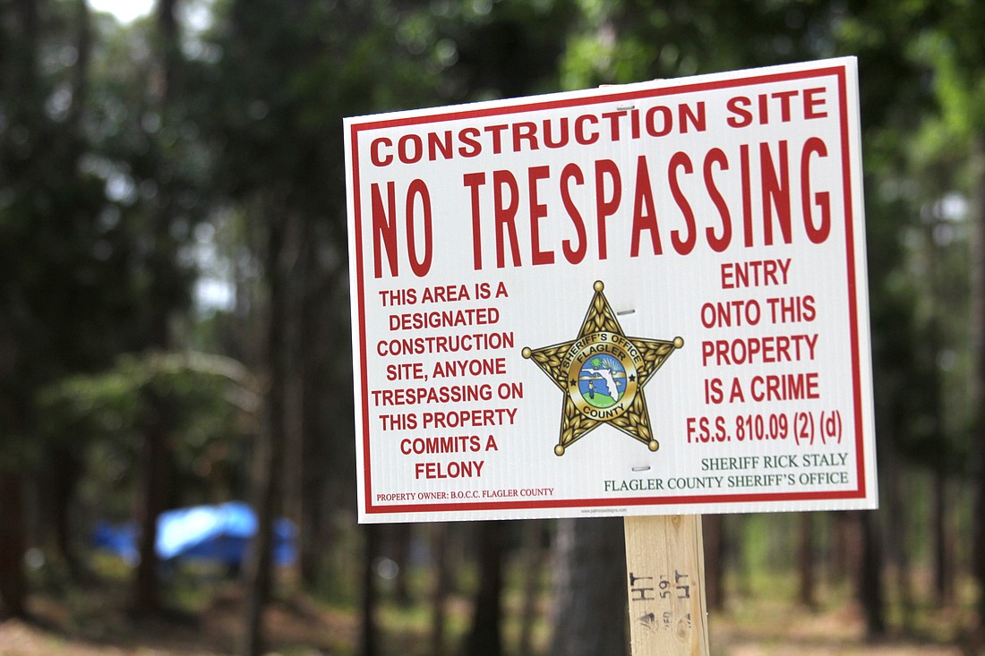 The library will no longer be a homeless camp: "No trespassing" signs go into effect May 1. Photo by Brian McMillan