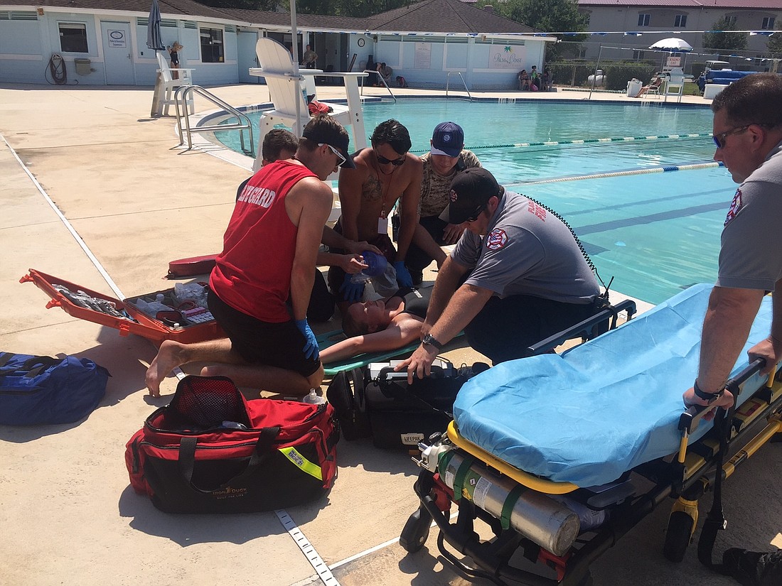 Fire Department personnel and City staff demonstrate a water rescue at Pool Safety Day during spring 2017. Photo courtesy of the city of Palm Coast