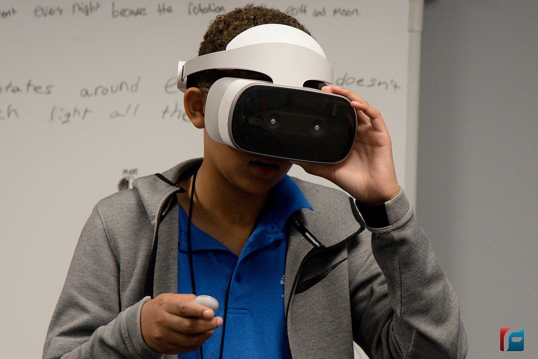 A Buddy Taylor Middle School student shows off a pair of virtual reality goggles. Photo courtesy of Flagler Schools