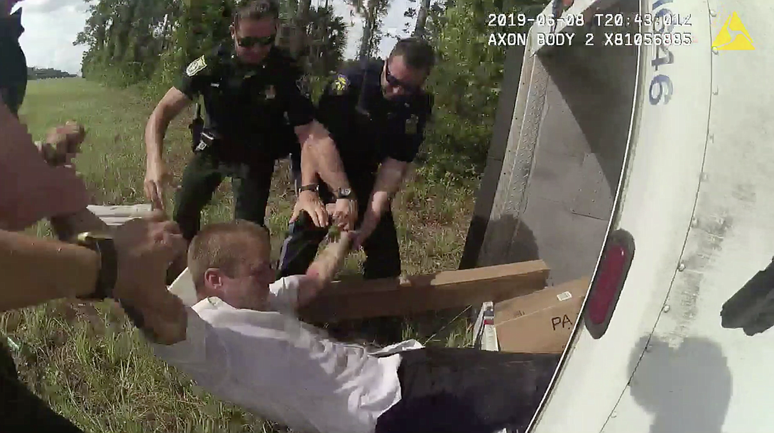 Deputies pull suspect Jesse Estep from the stolen mail truck. Image from body camera footage, courtesy of the FCSO.