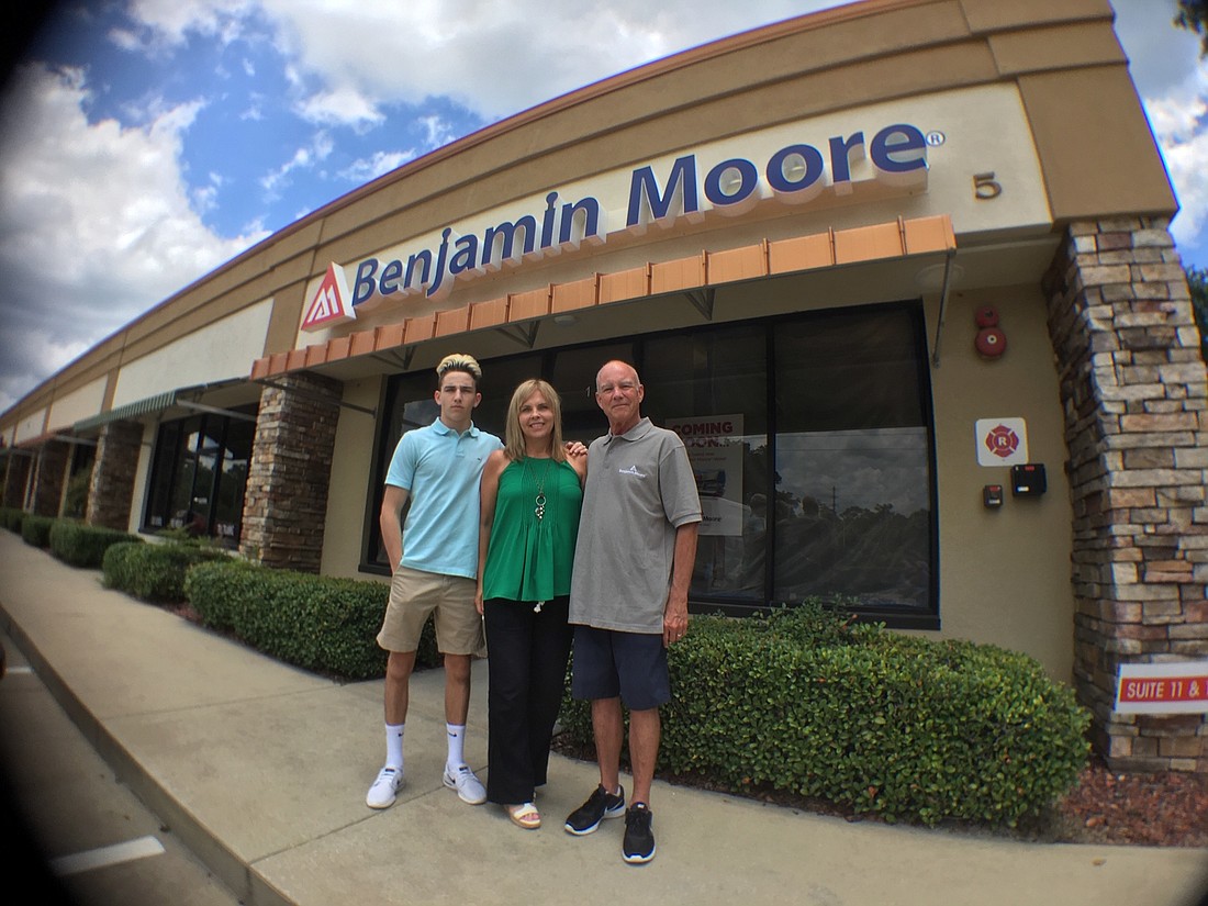 Ethan Goodman (left), Karla Goodman and Allen Goodman at the new Benjamin Moore paint store in Palm Coast. Courtesy photo